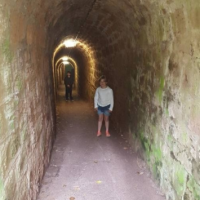 Tunnel In England With Human Figure Behind The Boy