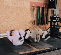 Women Work Out At The Gym